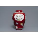 A fine Chinese famille rose ruby ground baluster vase with floral panels, Yongzheng