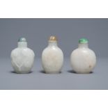 Three Chinese carved pale white jade snuff bottles, 19/20th C.