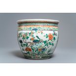 A Chinese famille verte fish bowl with birds among flowers, 19th C.