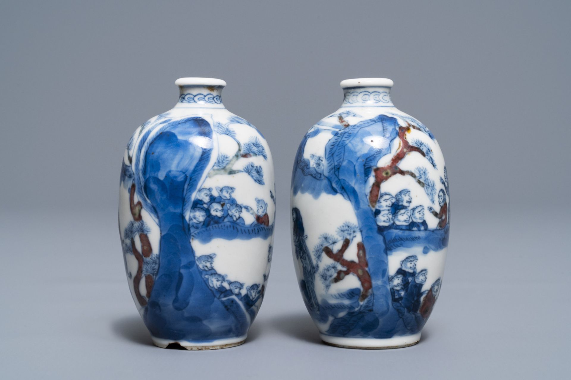 A pair of Chinese blue, white and underglaze red '16 monkeys' snuff bottles, Yongzheng mark, 19th C. - Image 2 of 7