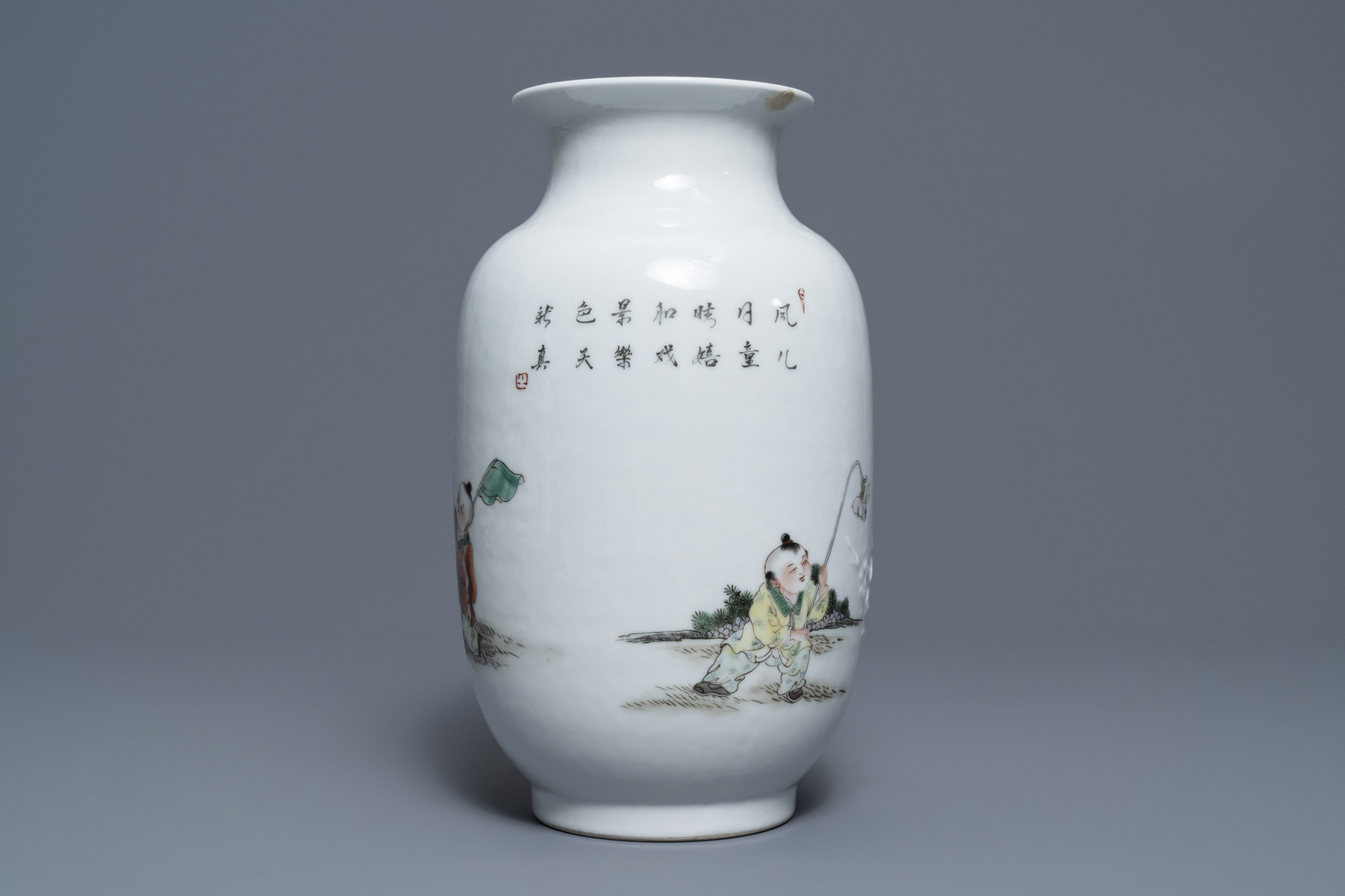 A Chinese famille rose relief-decorated vase with playing boys, Qianlong mark, Republic, 20th C. - Image 4 of 7