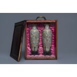 A pair of Chinese famille rose 'millefleurs' eggshell vases, Qianlong mark, Republic, 20th C.
