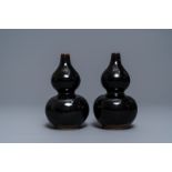 A pair of Chinese dark brown-glazed double gourd vases, Qianlong