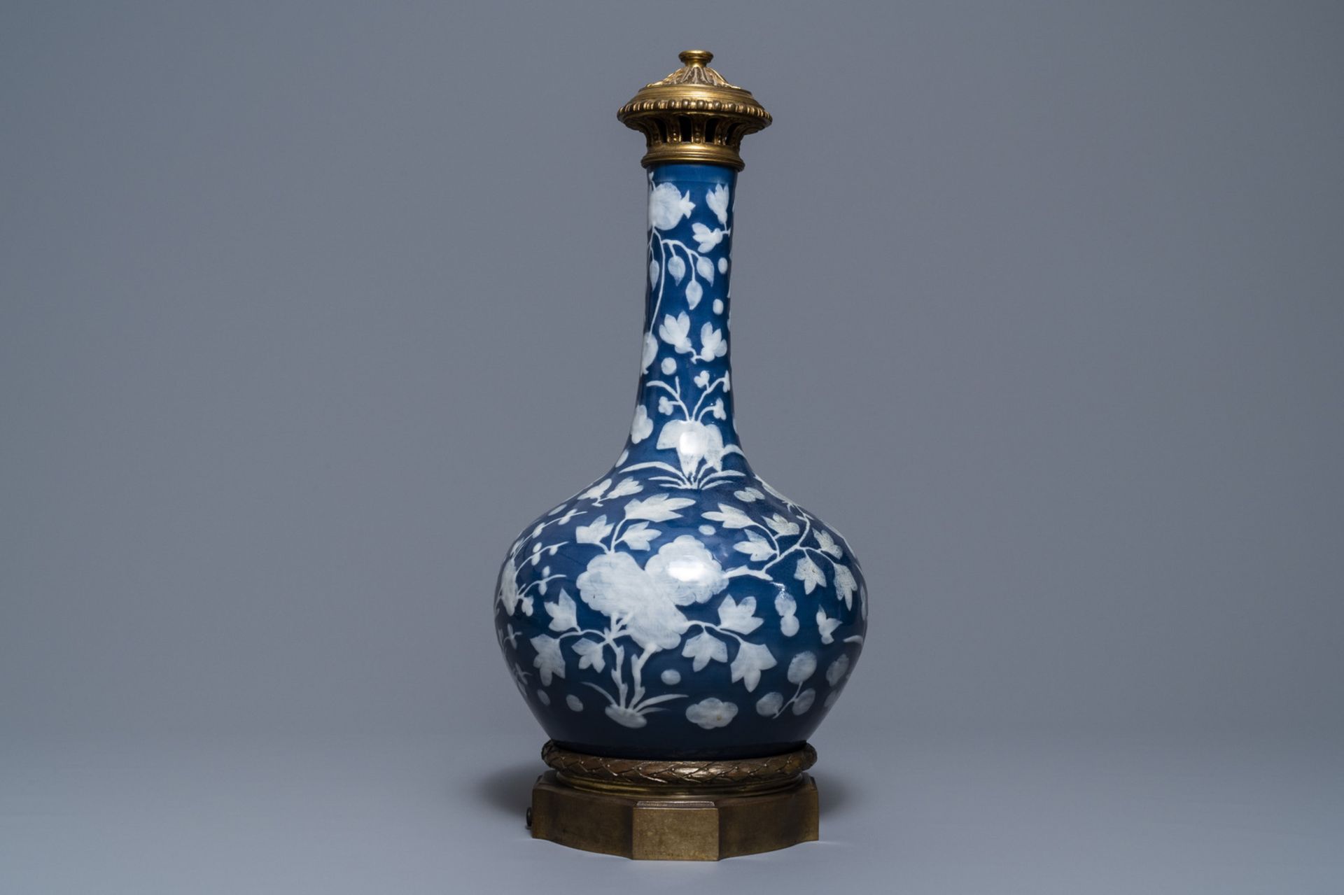 A Chinese blue-ground slip-decorated bottle vase with ormolu mounts, 19th C. - Image 3 of 7