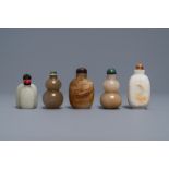 Five Chinese celadon and russet jade snuff bottles, 19/20th C.