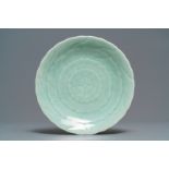 A Chinese celadon chrysanthemum plate, Qianlong mark and of the period
