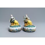 A pair of polychrome Dutch Delft butter tubs with ladies selling flowers and fruits, 18th C.