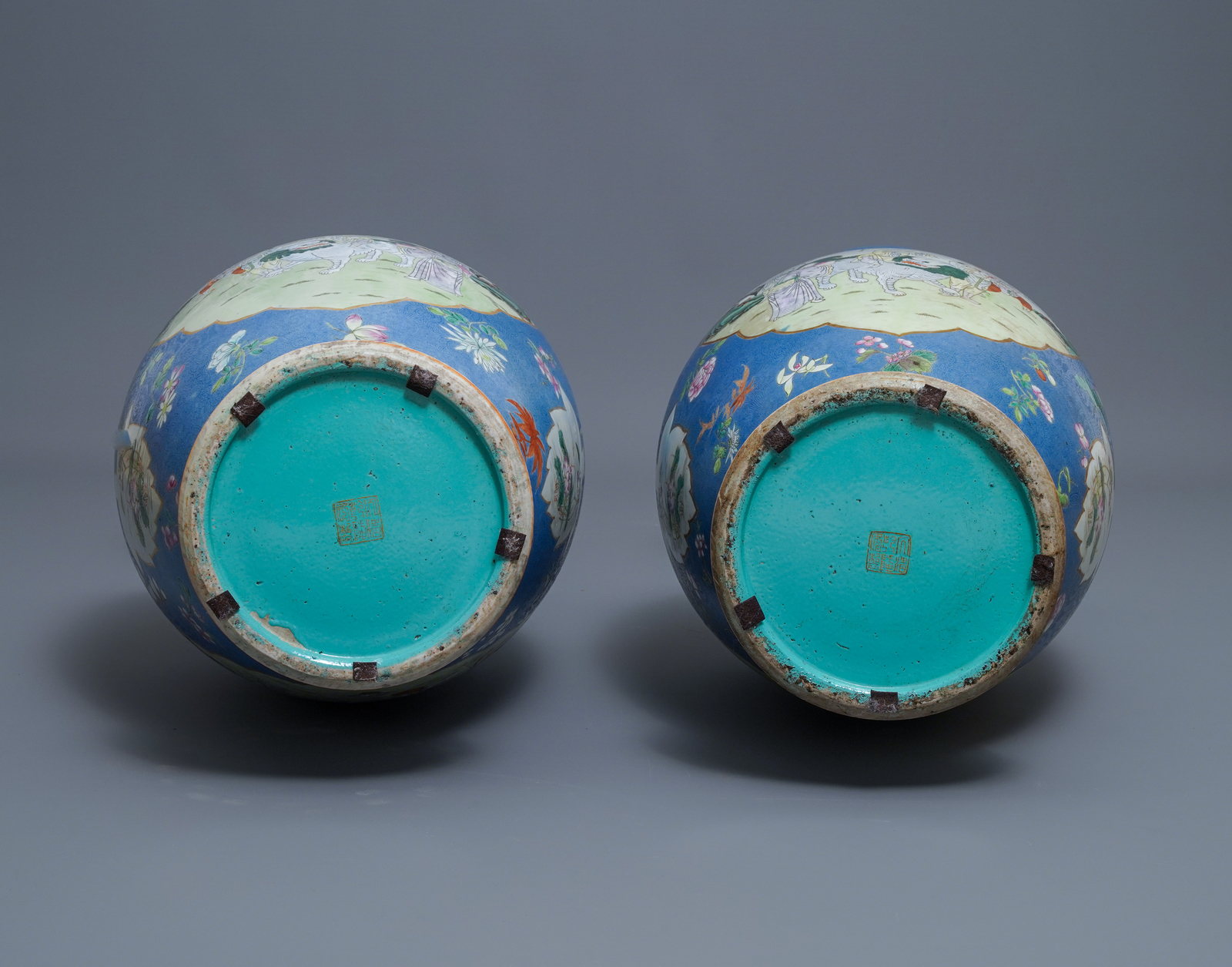 A pair of large Chinese blue-ground famille rose vases with figural design, Qianlong mark, 19th C. - Image 6 of 6