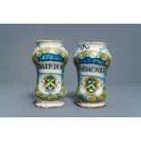 A pair of Italian maiolica armorial albarelli, Deruta, dated 1562