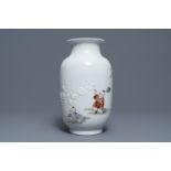 A Chinese famille rose relief-decorated vase with playing boys, Qianlong mark, Republic, 20th C.