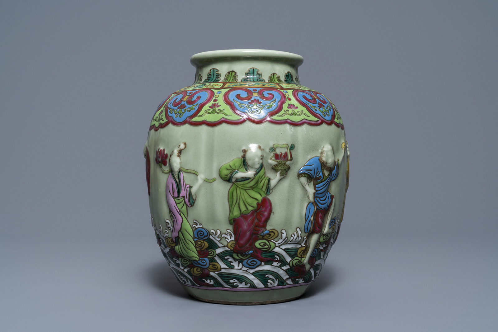 A Chinese relief-decorated famille rose celadon-ground vase, 19/20th C. - Image 2 of 7