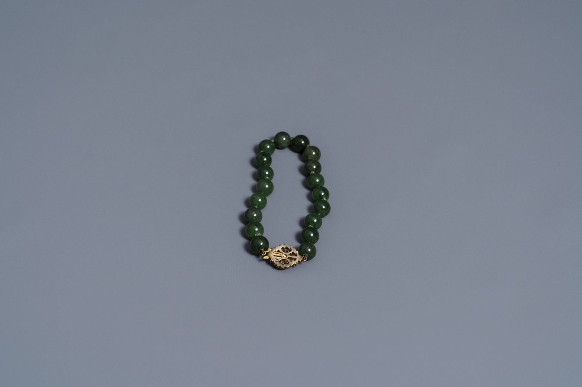 Two Chinese necklaces and a bracelet with spinach green jade beads, 20th C. - Image 3 of 5