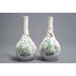 A pair of Chinese famille rose bottle vases with birds and flowers, Yongzheng