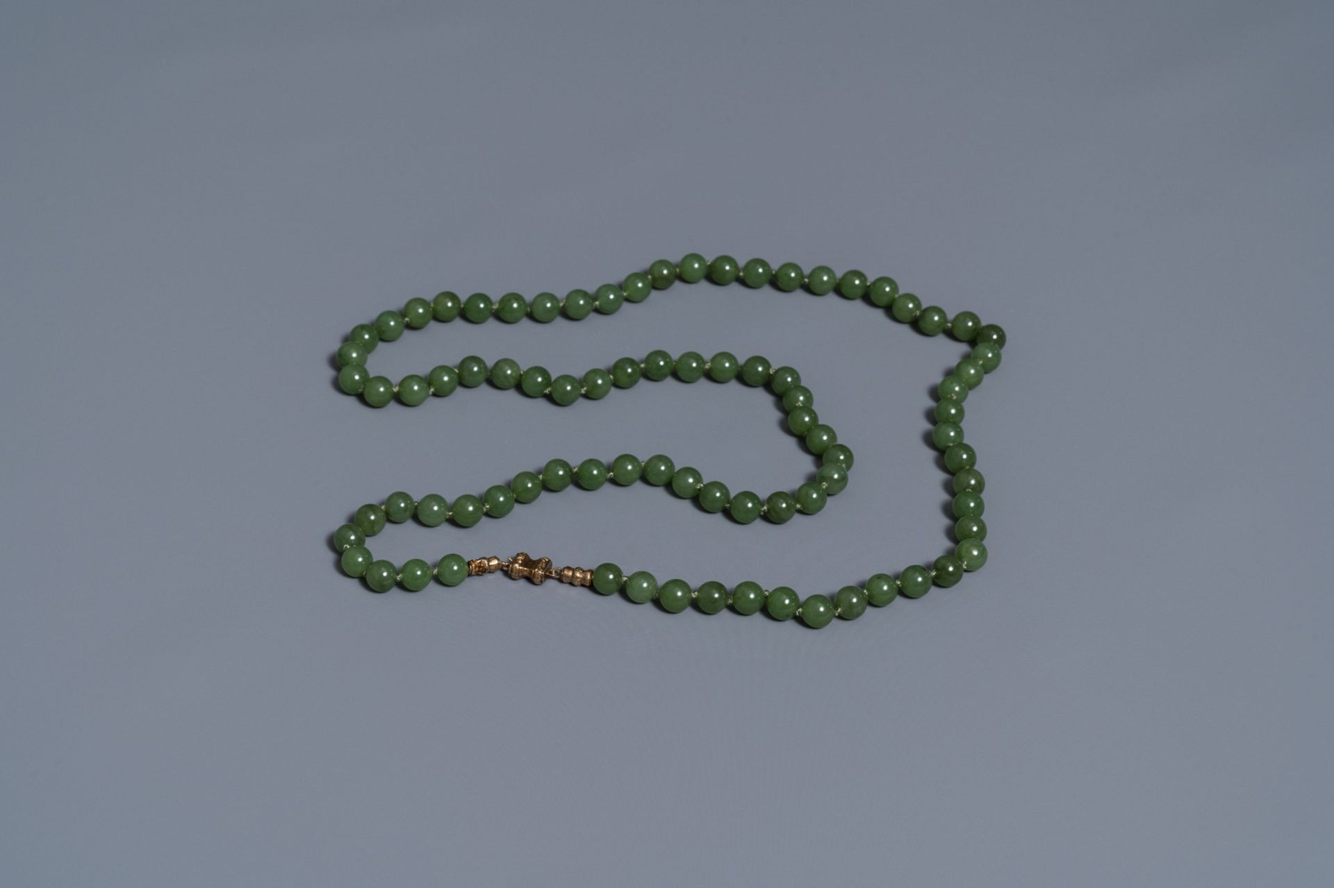 Two Chinese necklaces and a bracelet with spinach green jade beads, 20th C. - Image 5 of 5