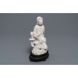 A Chinese Dehua blanc de Chine model of Guanyin, seal mark on the back, 19th C.