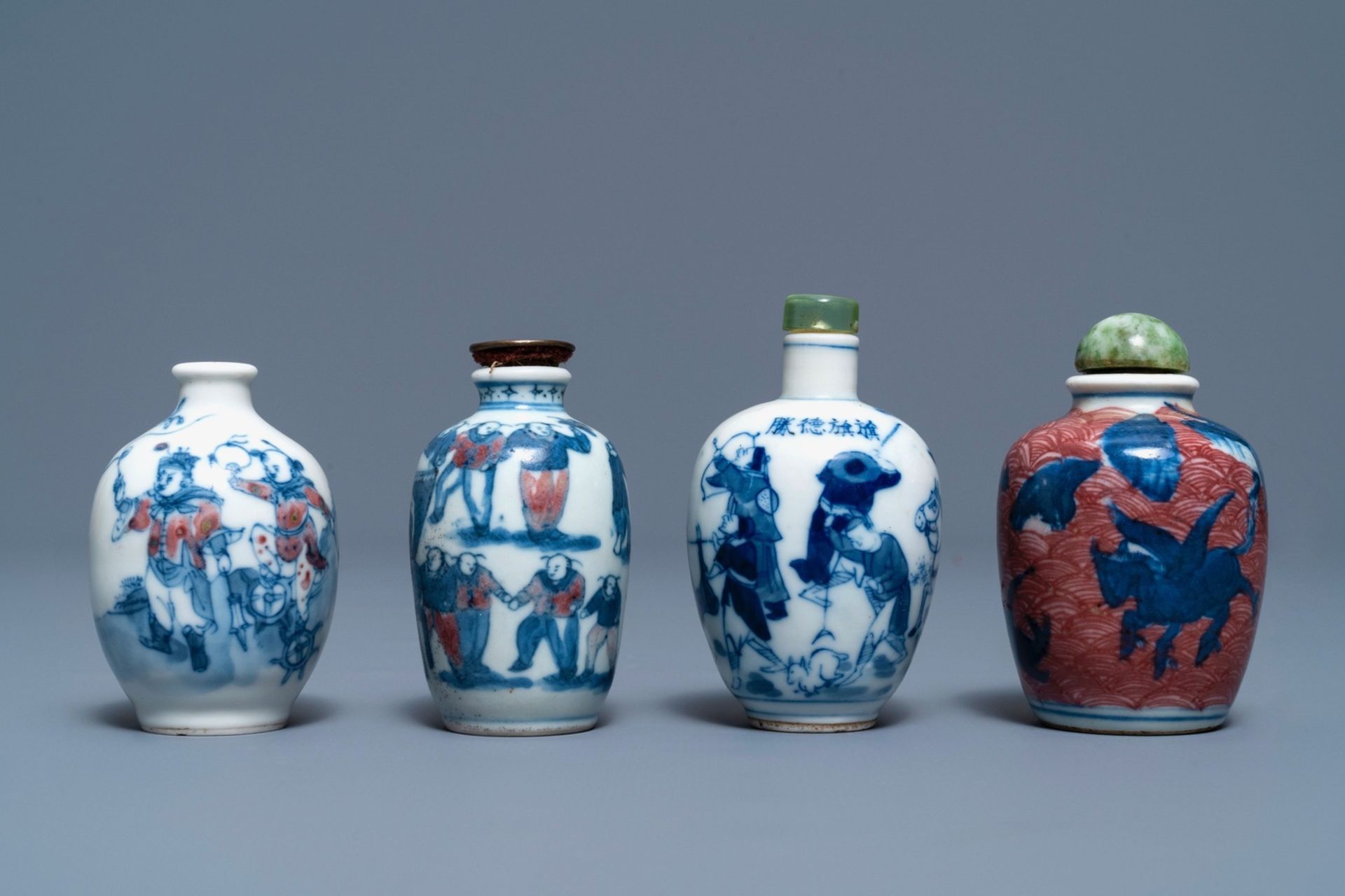 Four Chinese blue, white and underglaze red snuff bottles, 19/20th C.