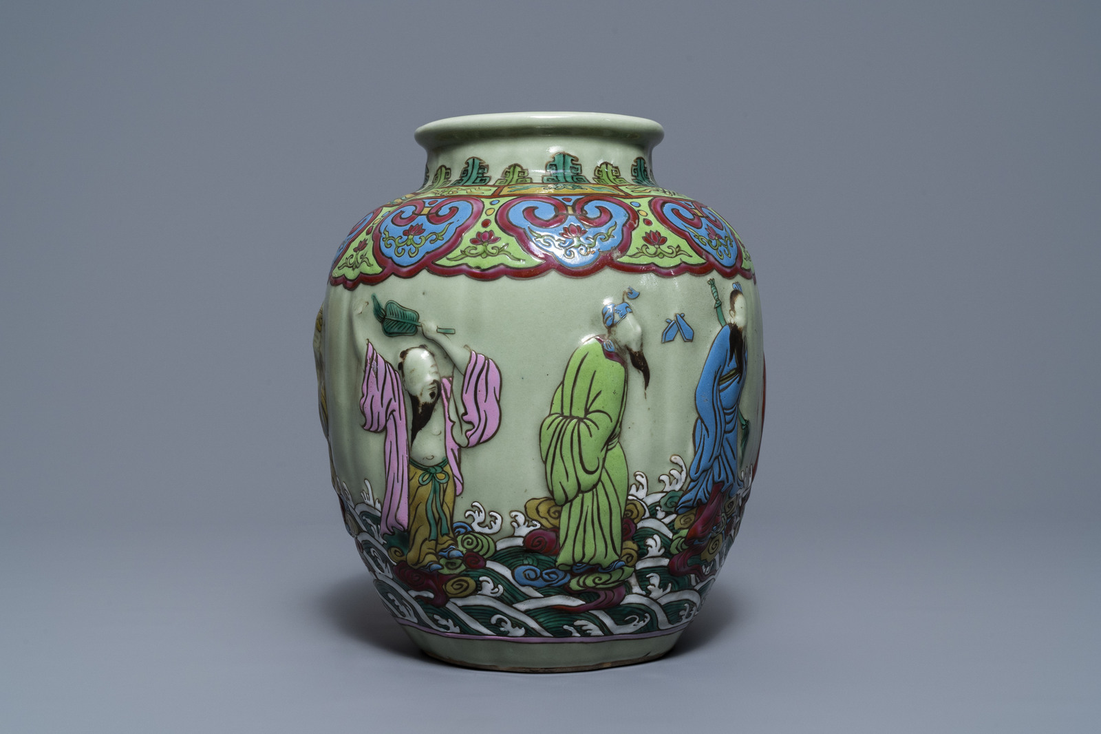 A Chinese relief-decorated famille rose celadon-ground vase, 19/20th C. - Image 4 of 7