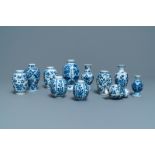 Eleven small Chinese blue and white vases with floral design, Kangxi