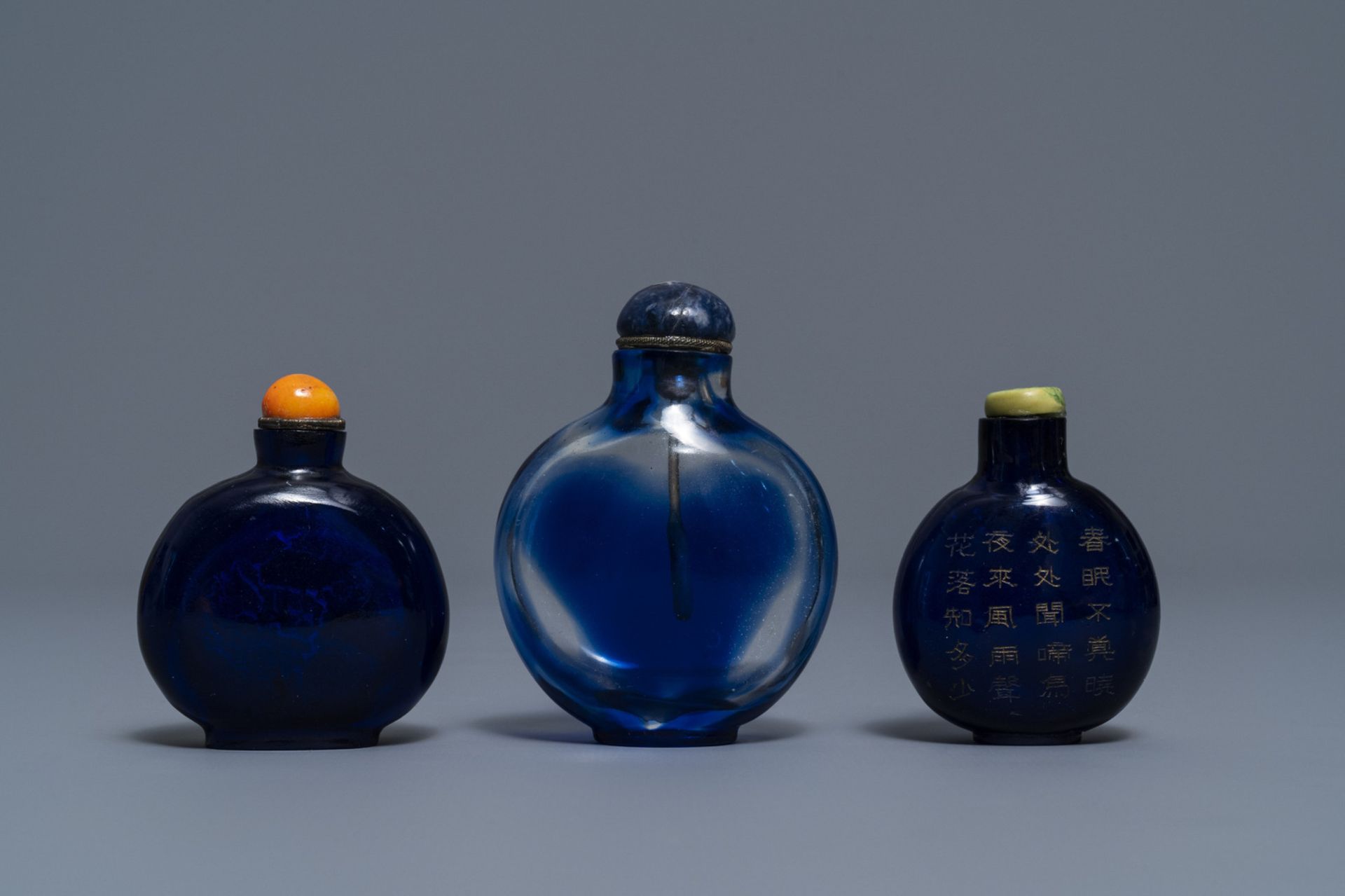 Three Chinese transparent blue glass snuff bottles, one inscribed, 18/19th C. - Image 2 of 4