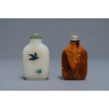 Two Chinese hardstone-embellished white jade and carved amber snuff bottles,18/19th C.
