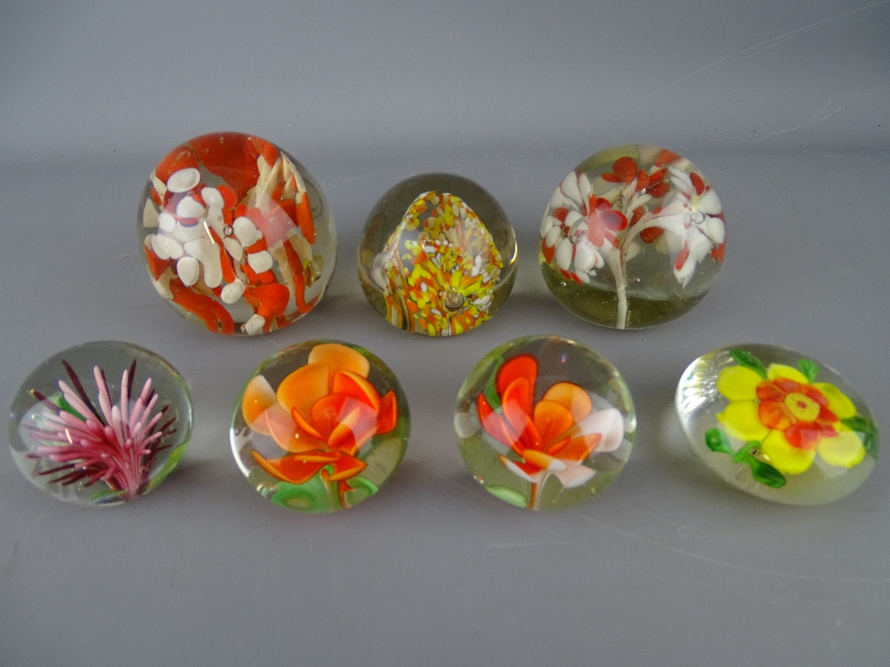 Seven vintage paperweights with floral type inclusion