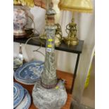 Large serpentine stone table lamp in the form of a lighthouse having steps carved into the base,