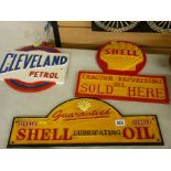 Two Shell oil and one Cleveland petrol vintage style advertising signs