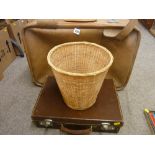 Vintage case with 'E R' and crown stamp, a mid Century suitcase and a wicker wastepaper basket