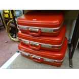 Graduating set of three vintage Spartanite travel cases in vibrant red