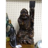 Carved Chinese wooden figurine and an African ebony example