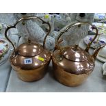 Near pair of Georgian copper kettles