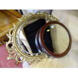 Vintage mahogany framed oval wall mirror and a fancy mid Century gilt example