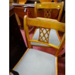 Yew single pedestal inlaid drop leaf dining table and two chairs