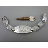 Aluminium trench art bracelet dated 1944 'Do Not Forget Me' and a bullet pendant mounted with a 1918