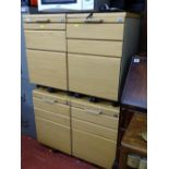 Four matching light wood and metal sets of office file drawers