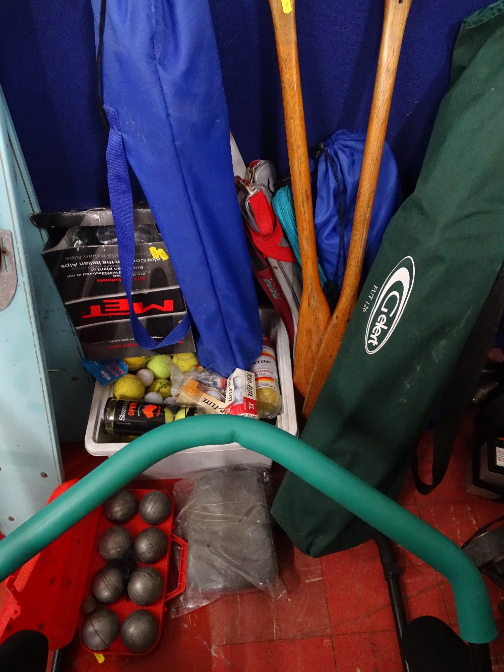 Plastic crate of various tennis balls, golf balls etc and wooden oars, folding camping chairs in