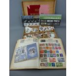 Small part filled album and booklet of stamps, an unsorted boxed quantity and two sets of Royal Mint