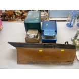 Wooden model of a boat hull and two Louis Marx & Co tinplate trucks