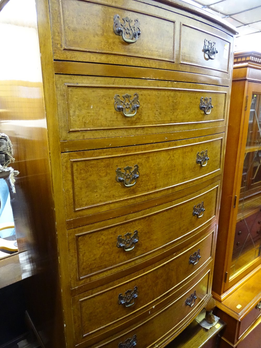 Burr walnut bow fronted chest of six drawers