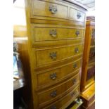 Burr walnut bow fronted chest of six drawers