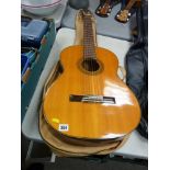 Acoustic guitar by Suzuki with vinyl case