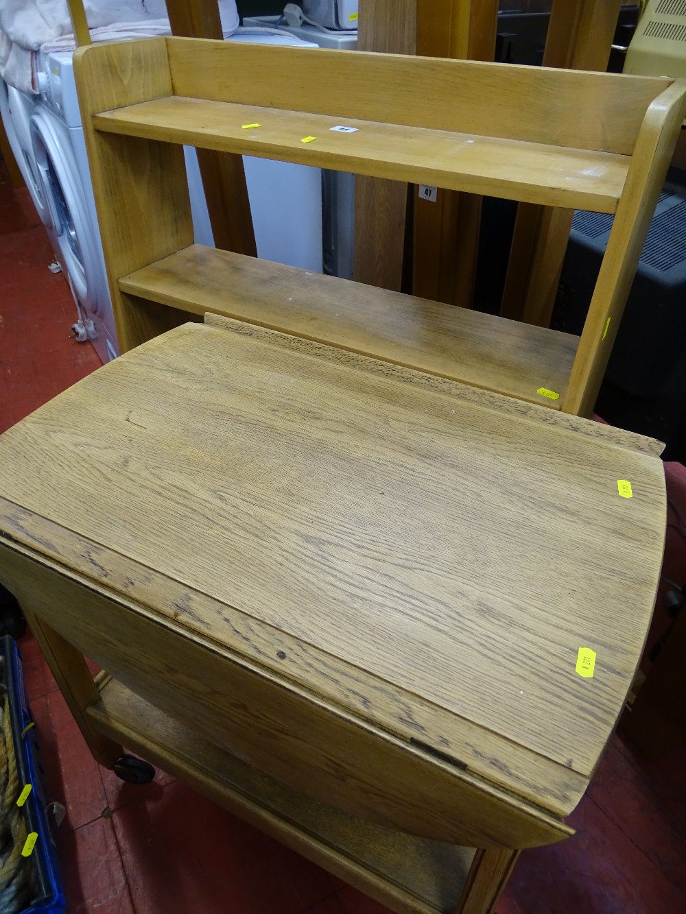 Stripped oak open bookcase and a twin flap two tier trolley