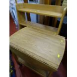 Stripped oak open bookcase and a twin flap two tier trolley