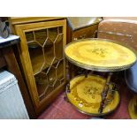 Italian inlaid circular two tier drinks wagon with a modern light wood single door display cabinet