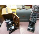 Beck of London vintage laboratory microscope in a wooden case and a cased vintage AMP projector