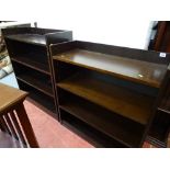 Two sets of dark wood bookshelves with adjustable interior shelves