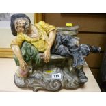 Capodimonte figure of an inebriated old man on a bench
