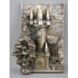 Mexican white metal embossed ornament of a castle turret with trees