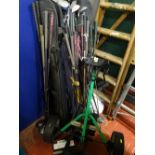 Electric golf buggy with battery (no charger) and a very large quantity of golf clubs E/T