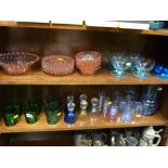 Two shelves of mixed glassware